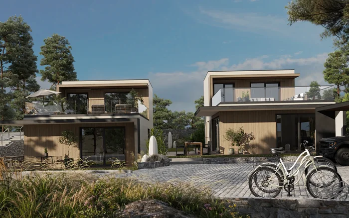 Two contemporary timber-clad HausGrid homes with shared courtyard and bicycles