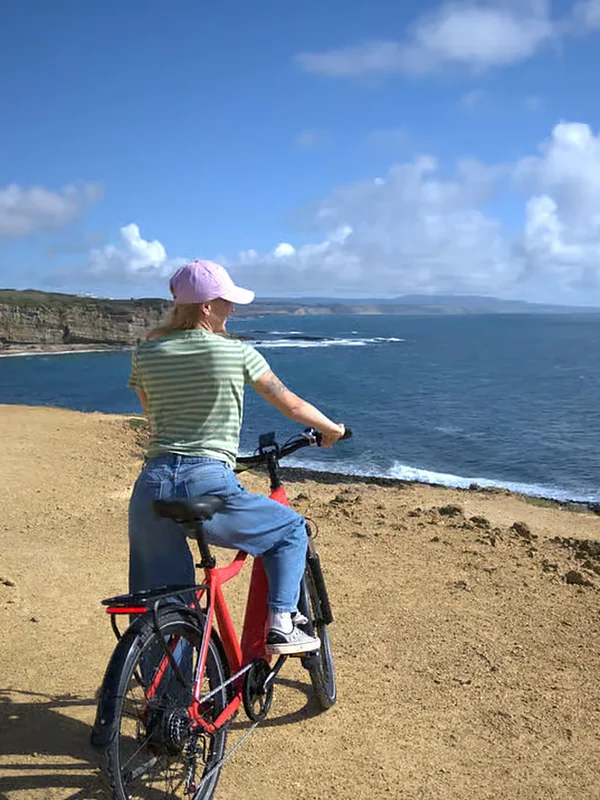A cyclist on a coastal track above the Atlantic